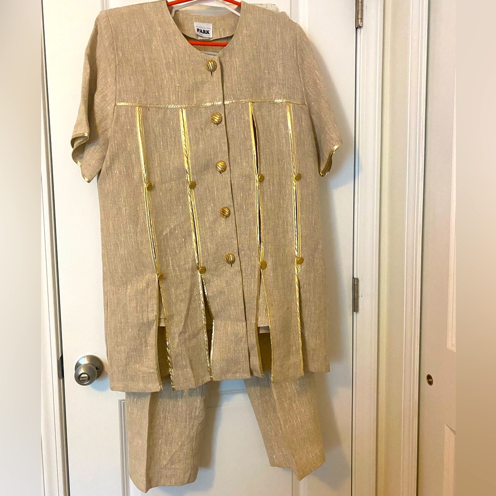 Linen pants suit in size L. Suit comes with pants, jacket and interior vest.